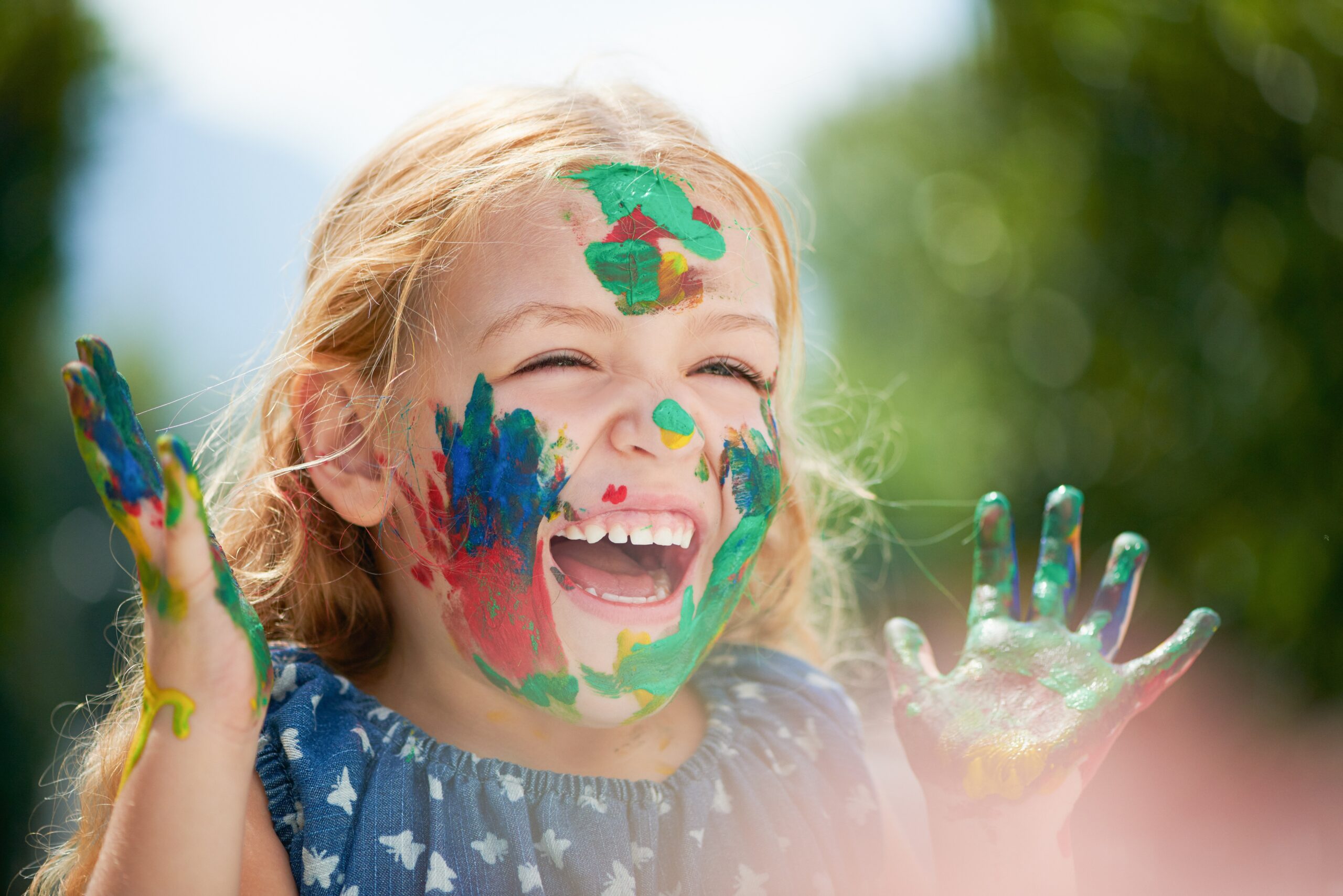 Happy,,Little,Girl,Covered,In,Paint,And,Outdoors,With,A