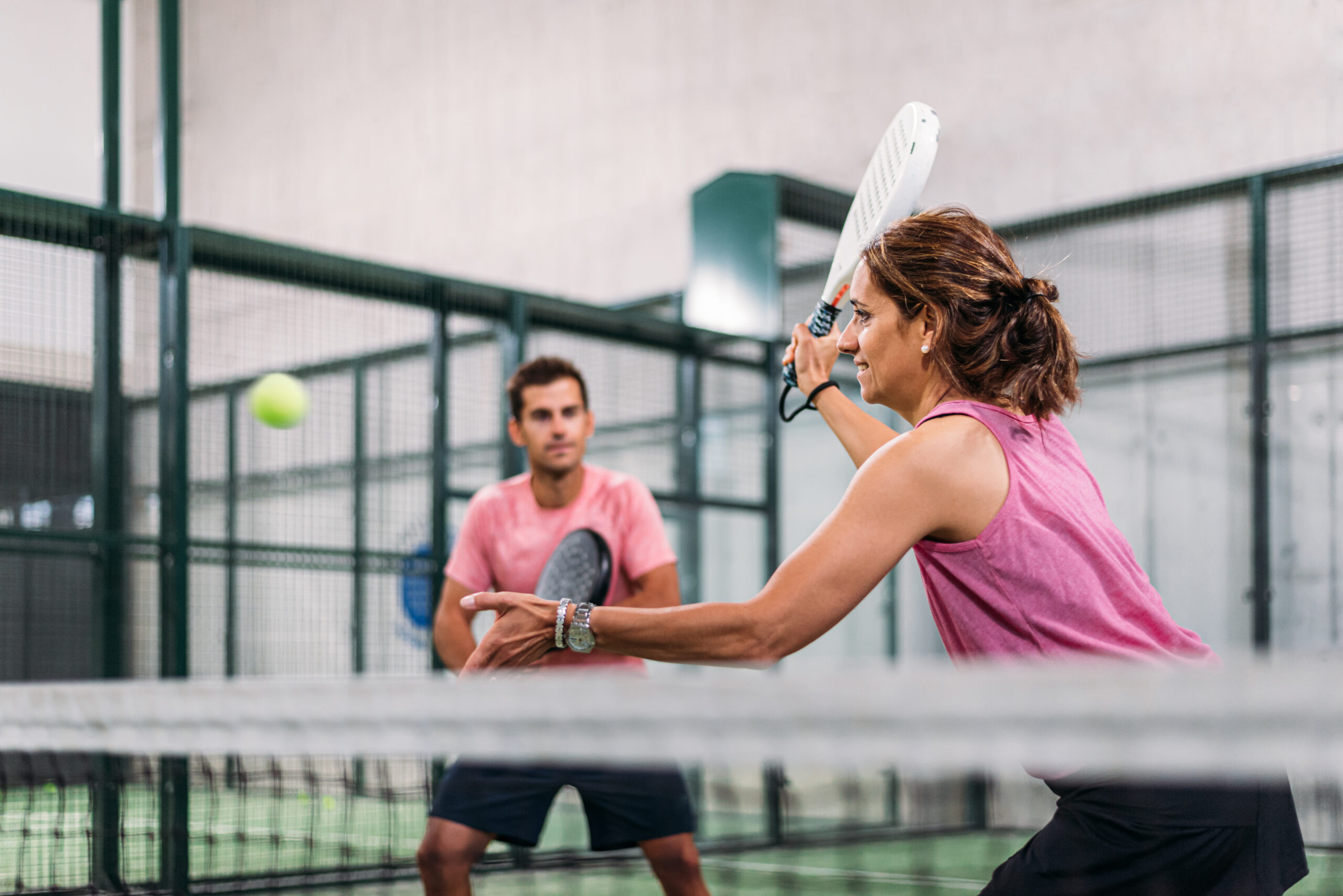 Mixed,Padel,Match,In,A,Green,Grass,Padel,Court,Indoor